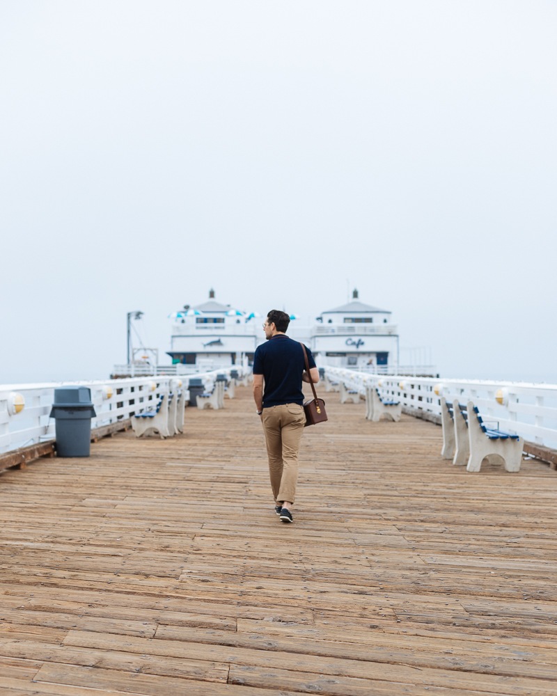 Lifestyle blogger Devin McGovern of Outlined Cloth takes a stroll in Malibu in original Sperry boat shoes