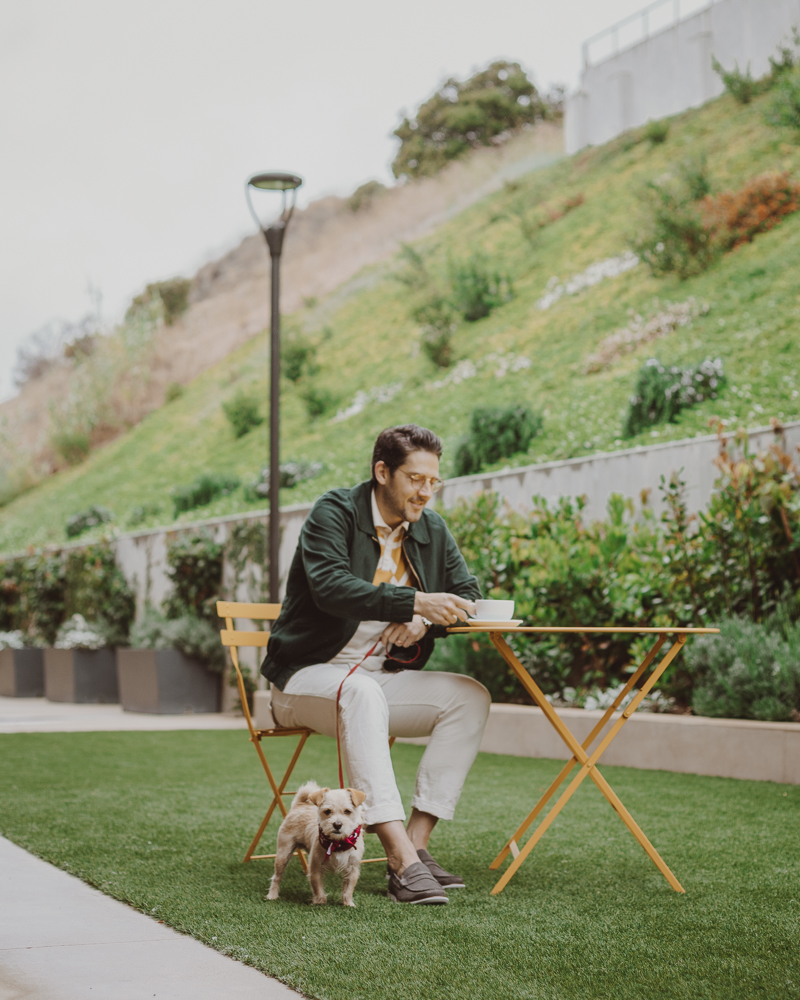 Lifestyle blogger Devin McGovern of Outlined Cloth takes a stroll in Malibu with a puppy and the Kennedy Loafers from Sperry