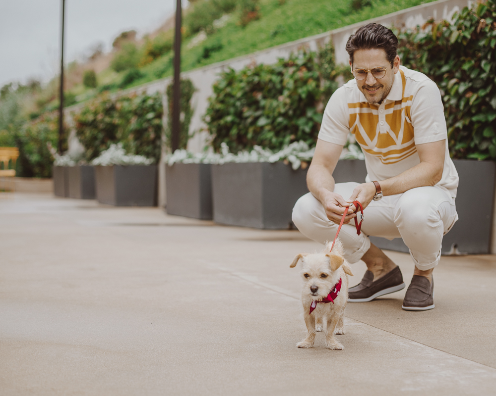 Lifestyle blogger Devin McGovern of Outlined Cloth takes a stroll in Malibu with a puppy and the Kennedy Loafers from Sperry