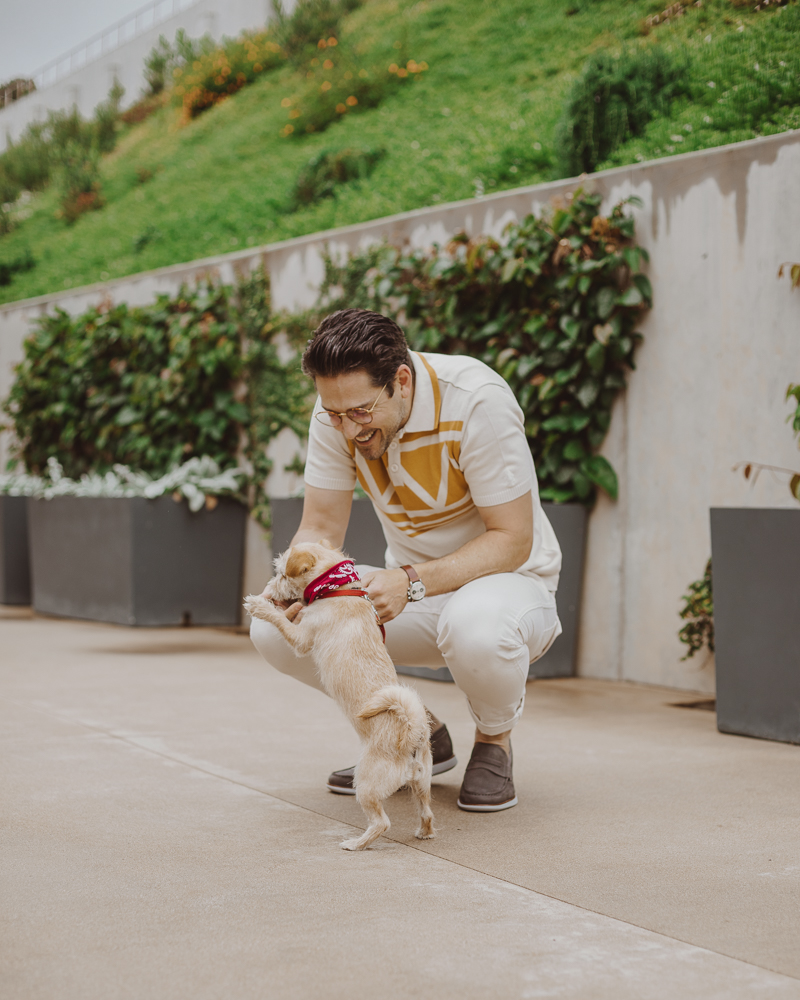 Lifestyle blogger Devin McGovern of Outlined Cloth takes a stroll in Malibu with a puppy and the Kennedy Loafers from Sperry